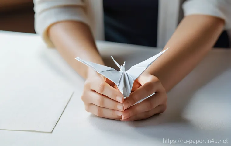 종이접기 오리가미  기술 - The Meditative Art of Origami**
A close-up, warm-toned photograph capturing a woman's hands, aged 25...